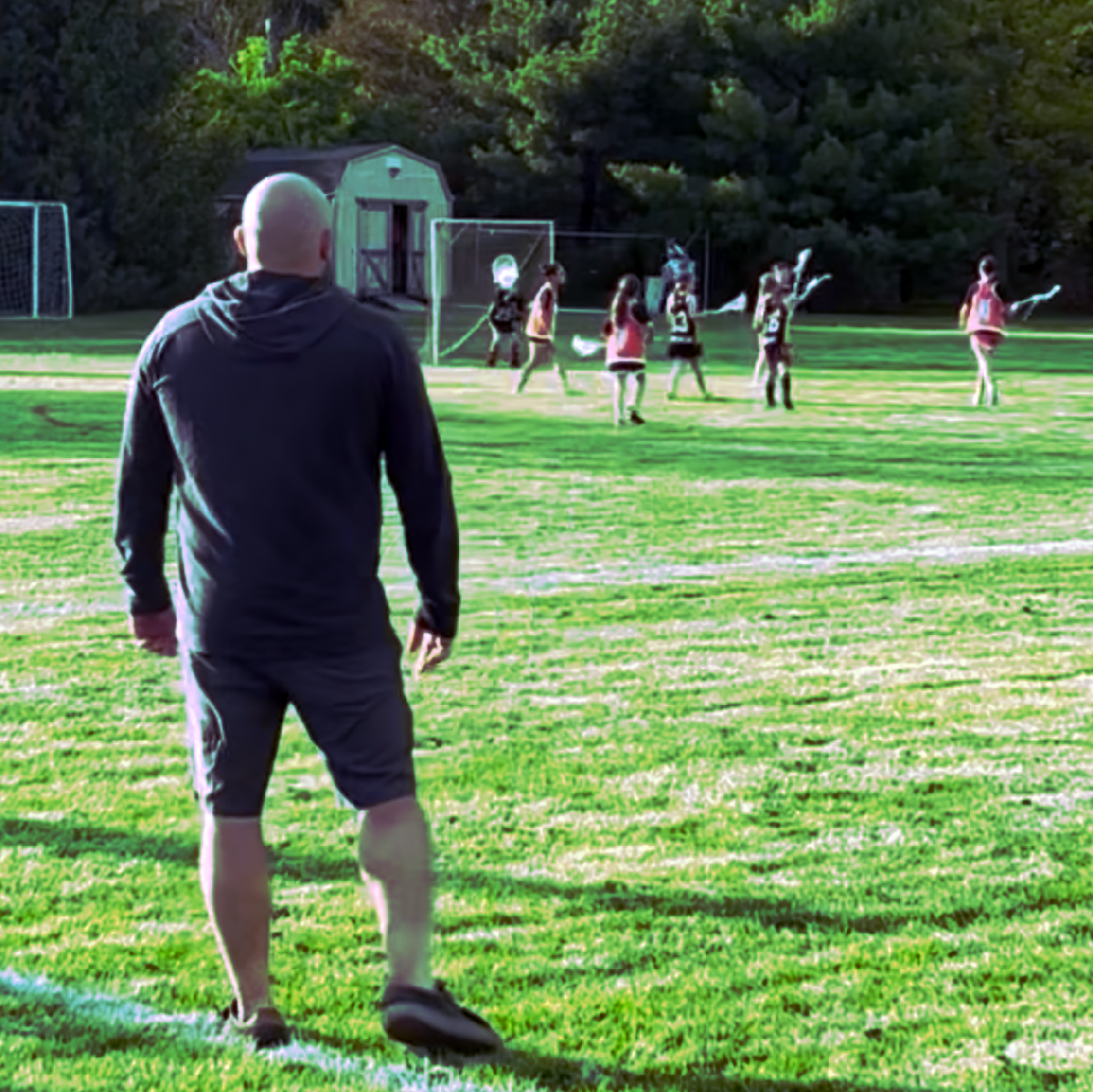 Michael coaching on the field